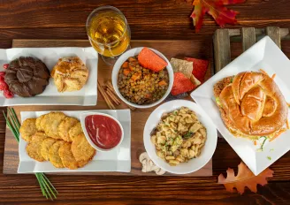A bird's eye view of a table full of autumnal food dishes